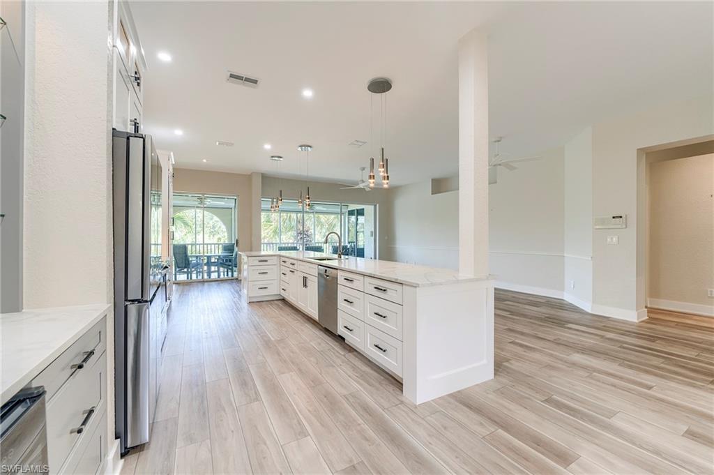 10751 Crooked River Road, Unit 202 Estero, FL 34135 - Photo 27 of 45 WINE COOLER AND PANTRY