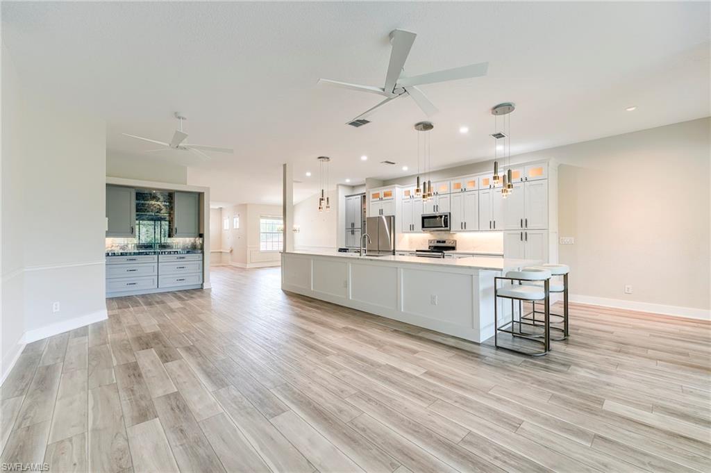 10751 Crooked River Road, Unit 202 Estero, FL 34135 - Photo 7 of 45 Luxury Vinyl Plank flooring in main living areas