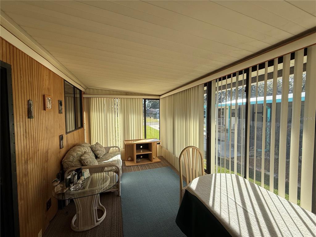 105 Cypress Road Wildwood, FL 34785 - Photo 24 of 26 a bedroom with furniture and a window