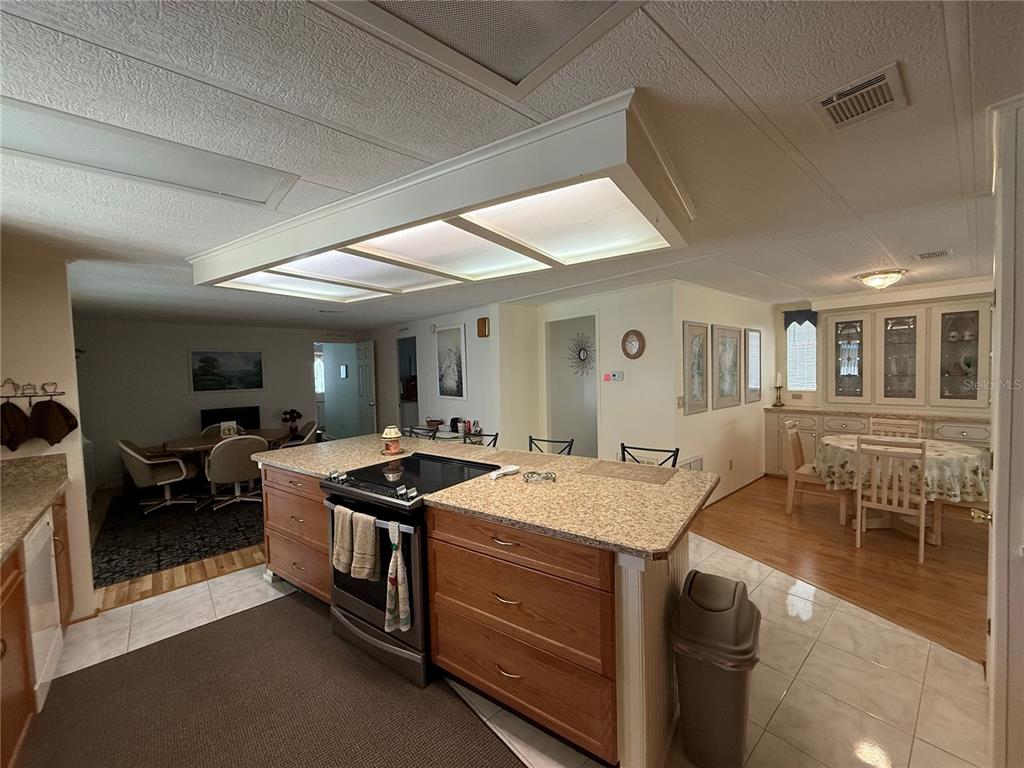 105 Cypress Road Wildwood, FL 34785 - Photo 4 of 26 a kitchen that has a sink and a stove