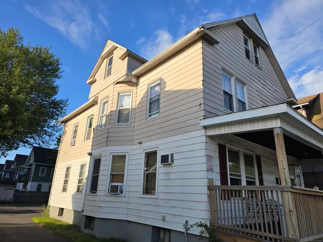 a view of a house with a street