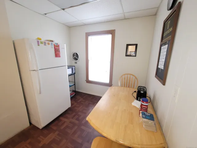a white refrigerator freezer sitting inside of a kitchen