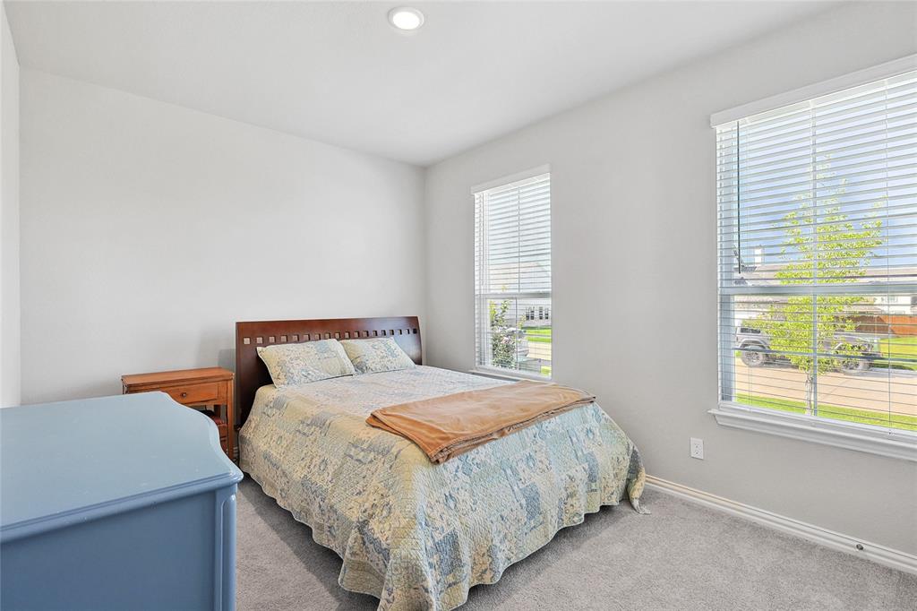 808 Feather Edge Drive Springtown, TX 76082 - Photo 30 of 40 a bedroom with a bed and window