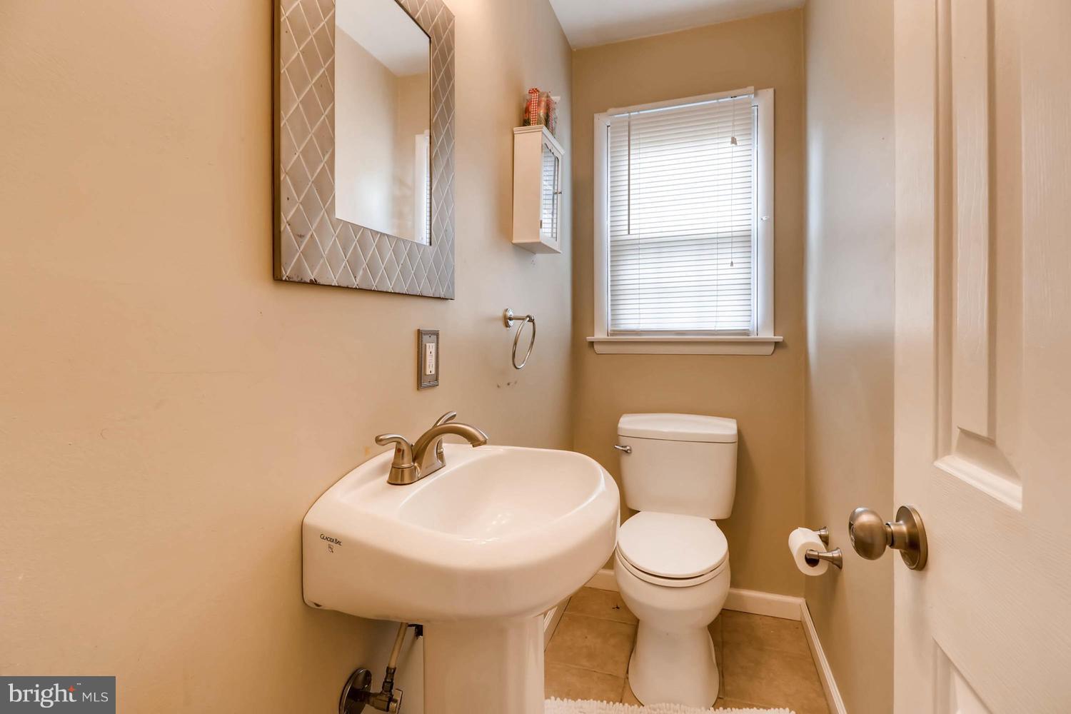 342 Old Joppa Road Fallston, MD 21047 - Photo 12 of 28 a bathroom with a toilet sink and mirror