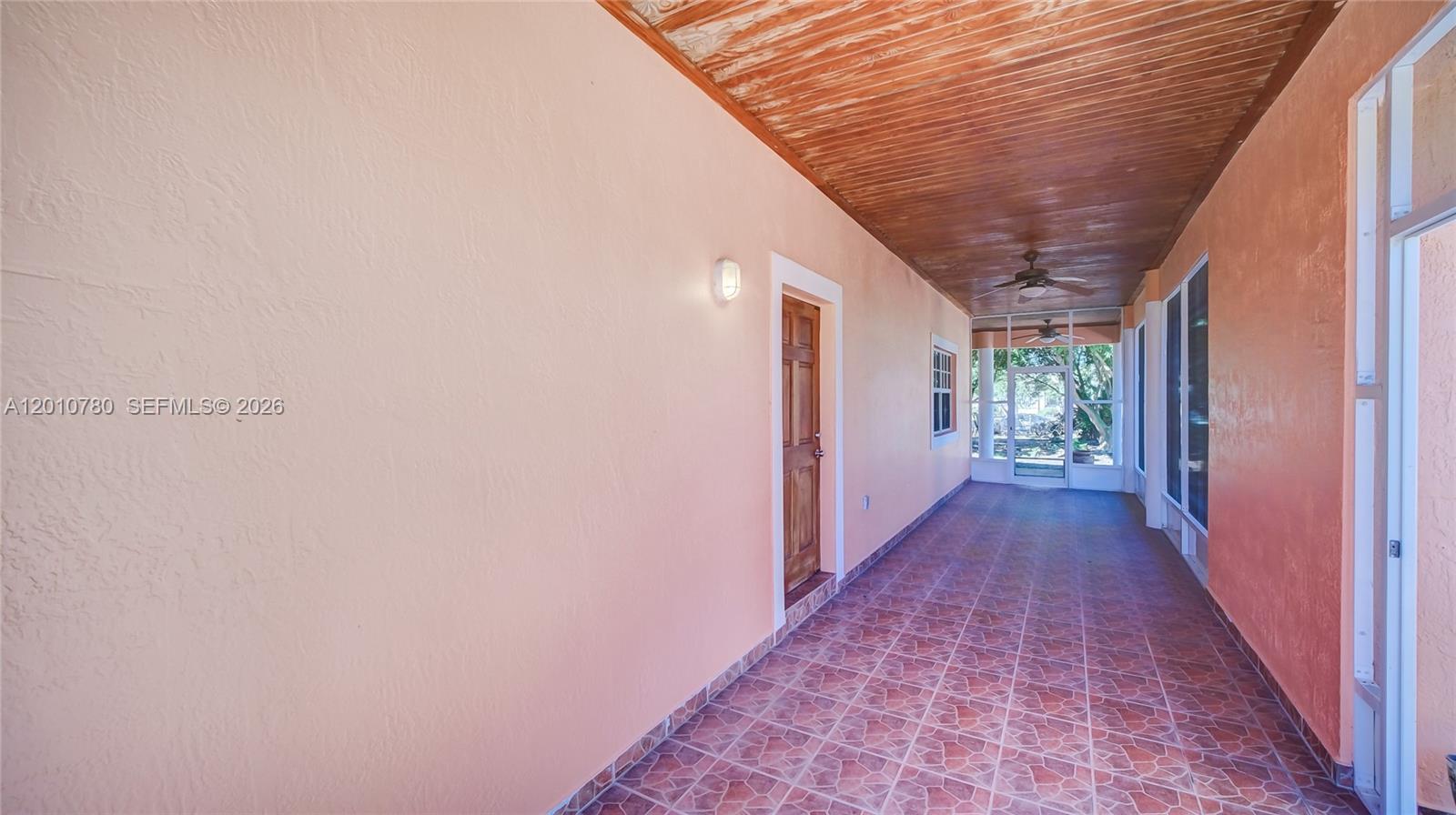 20400 Southwest 328th Street Homestead, FL 33030 - Photo 30 of 43 Patio between home and Garage