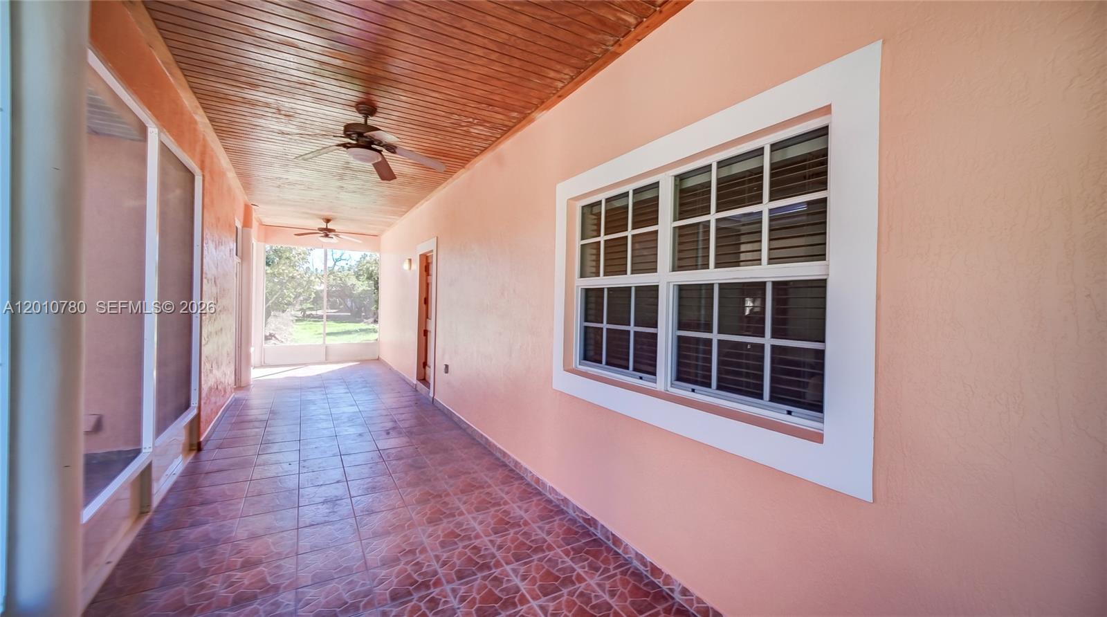 20400 Southwest 328th Street Homestead, FL 33030 - Photo 5 of 43 Patio Between Home and Garage