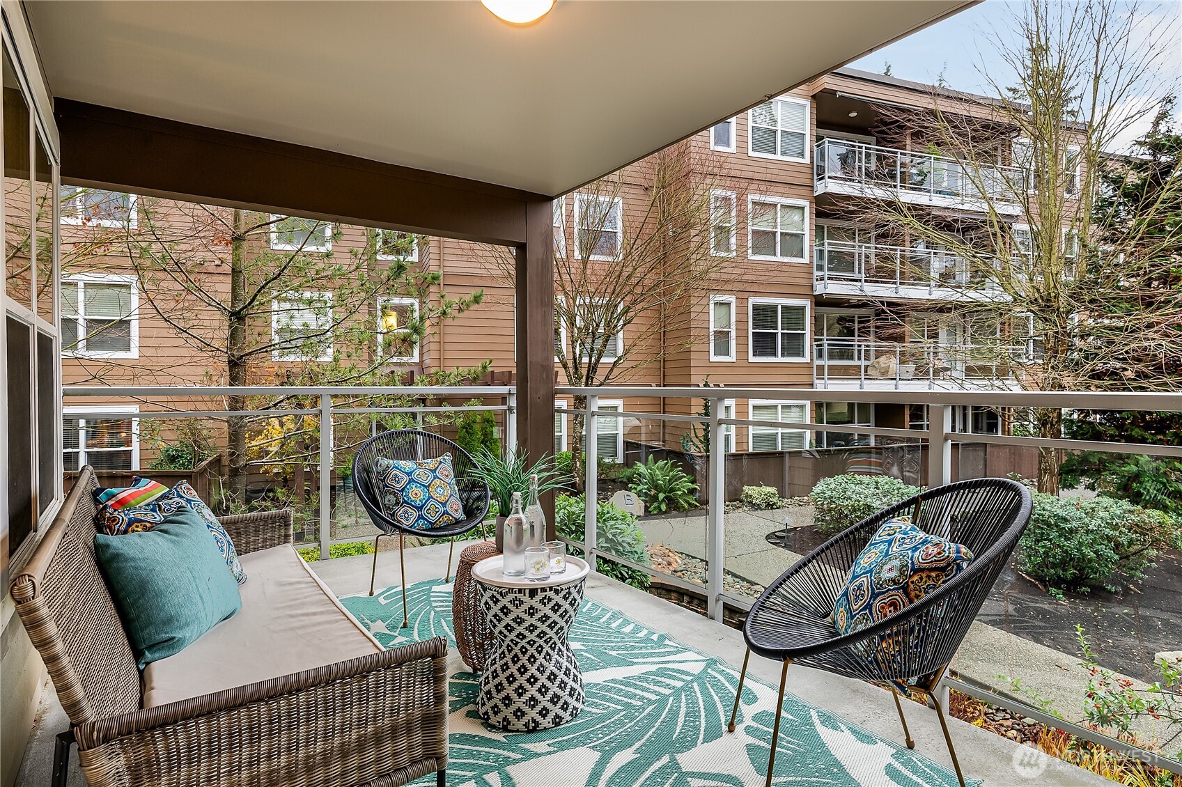 23015 Edmonds Way, Unit A214 Edmonds, WA 98020 - Photo 18 of 24 a view of a balcony with chairs and a table