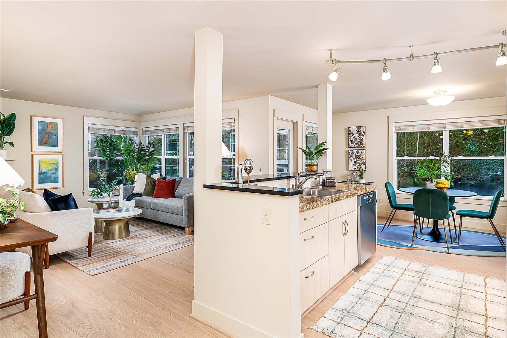 23015 Edmonds Way, Unit A214 Edmonds, WA 98020 - Photo 2 of 24 a living room with furniture and a large window