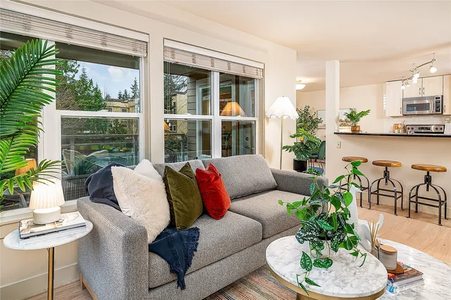 a living room with furniture and a large window