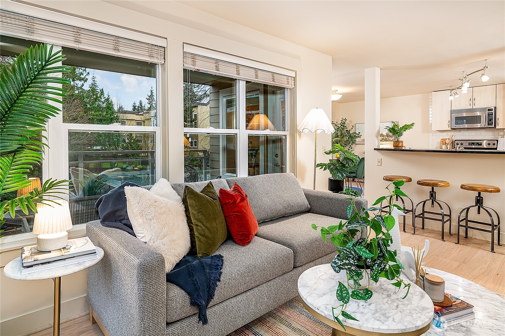 23015 Edmonds Way, Unit A214 Edmonds, WA 98020 - Photo 3 of 24 a living room with furniture and a large window