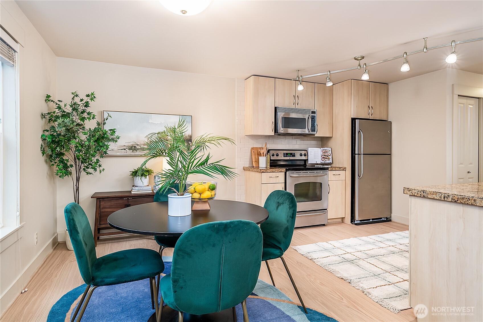 23015 Edmonds Way, Unit A214 Edmonds, WA 98020 - Photo 5 of 24 a view of kitchen with microwave and stove