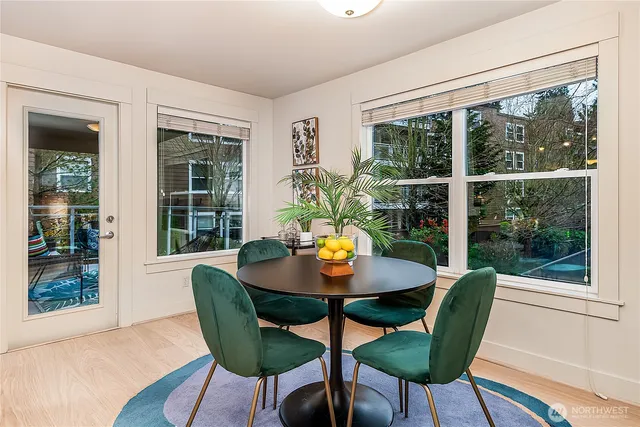 a view of a dining room with furniture window and wooden floor