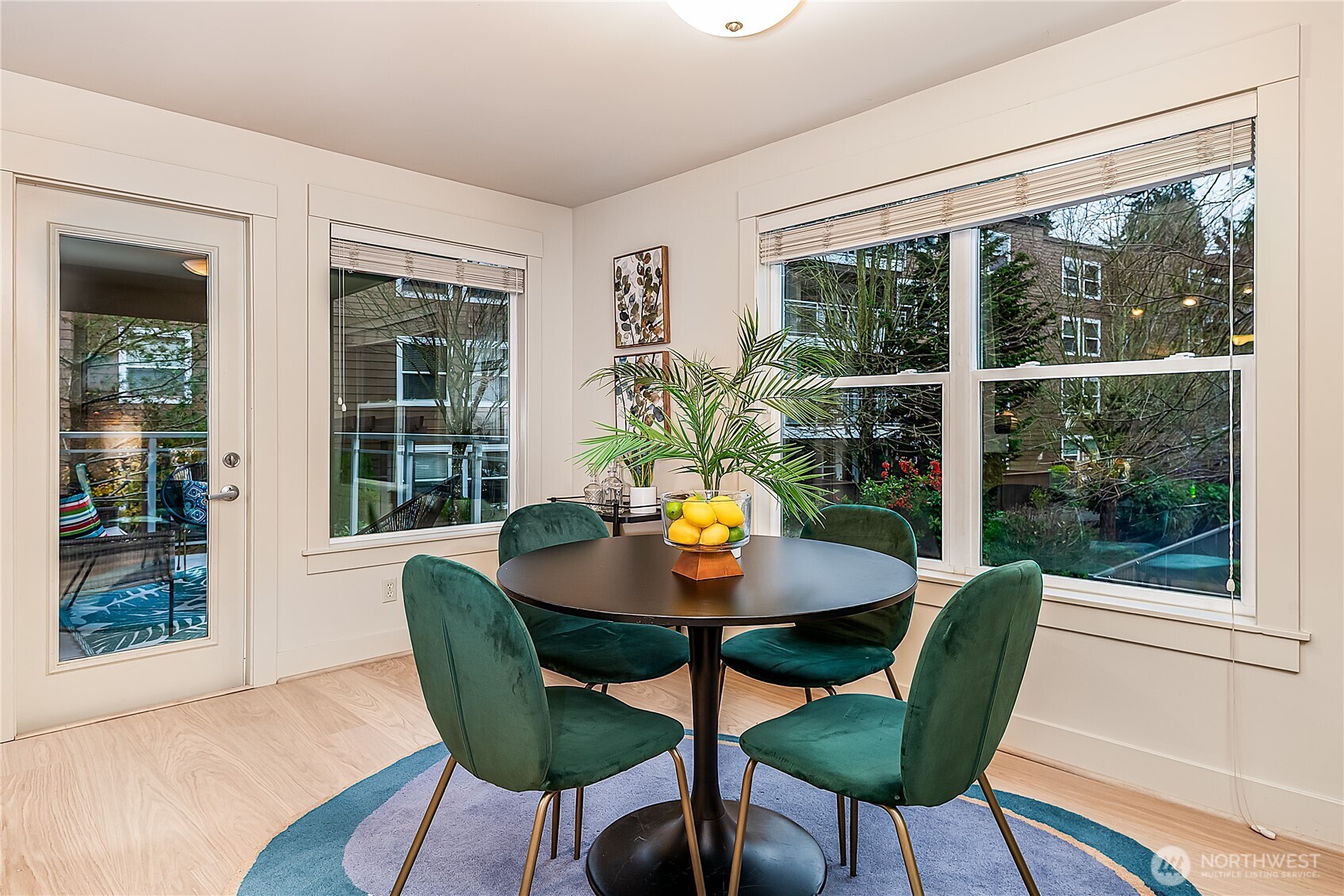 23015 Edmonds Way, Unit A214 Edmonds, WA 98020 - Photo 6 of 24 a view of a dining room with furniture window and wooden floor