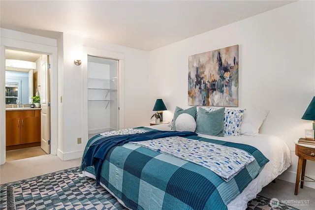 a bedroom with a large bed and a couch