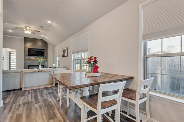 a view of a dining room with furniture and wooden floor