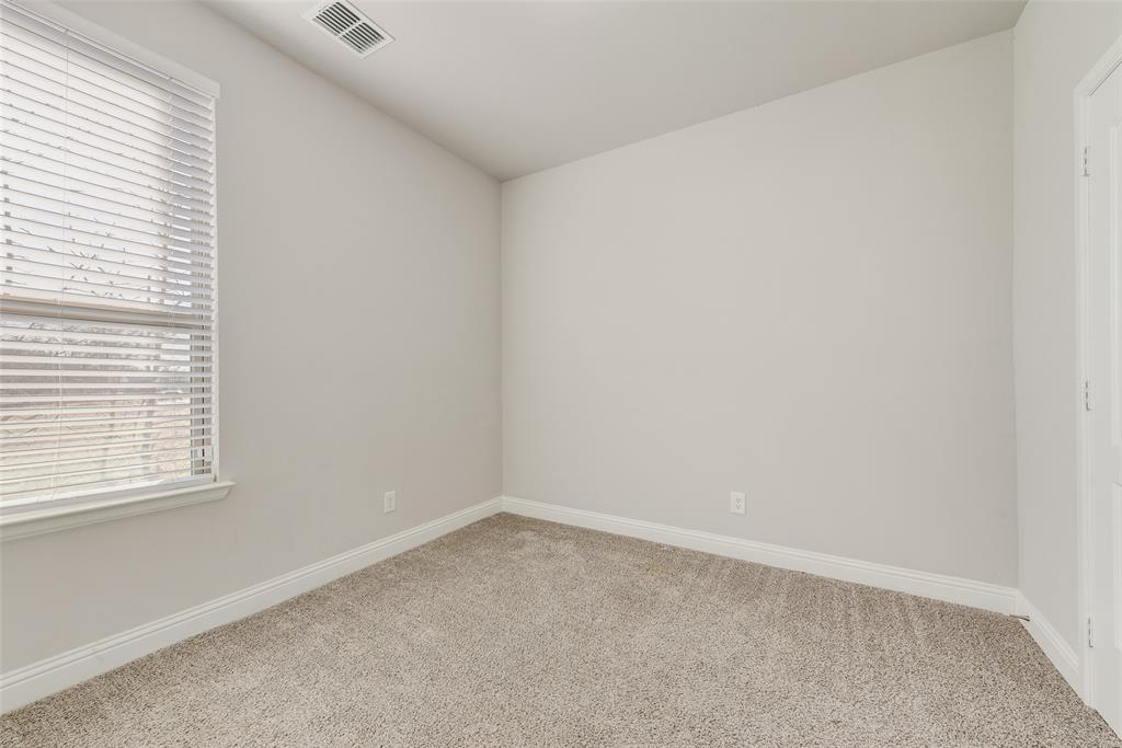 404 West Rochester Street Terrell, TX 75160 - Photo 17 of 24 an empty room with a window