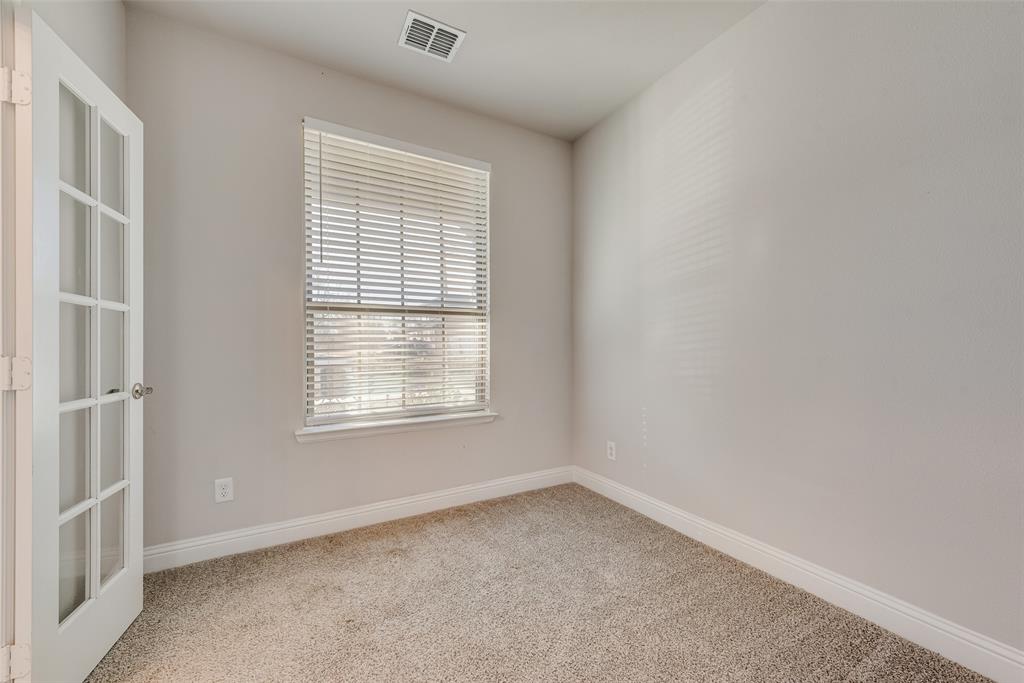 404 West Rochester Street Terrell, TX 75160 - Photo 19 of 24 an empty room with a window