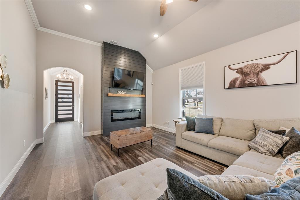 404 West Rochester Street Terrell, TX 75160 - Photo 2 of 24 a living room with furniture and a flat screen tv