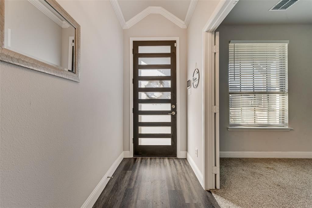 404 West Rochester Street Terrell, TX 75160 - Photo 22 of 24 a view of a room with a white door and wooden floor