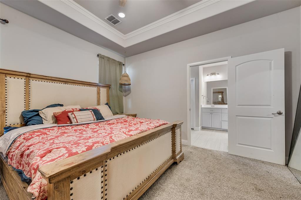 404 West Rochester Street Terrell, TX 75160 - Photo 8 of 24 a bedroom with a bed and a cabinets