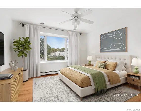 a living room with a bed furniture and a window