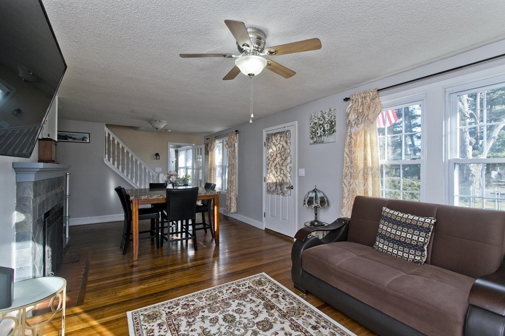 2020 Wilbraham Road Springfield, MA 01129 - Photo 12 of 37 a living room with furniture a fireplace and a chandelier
