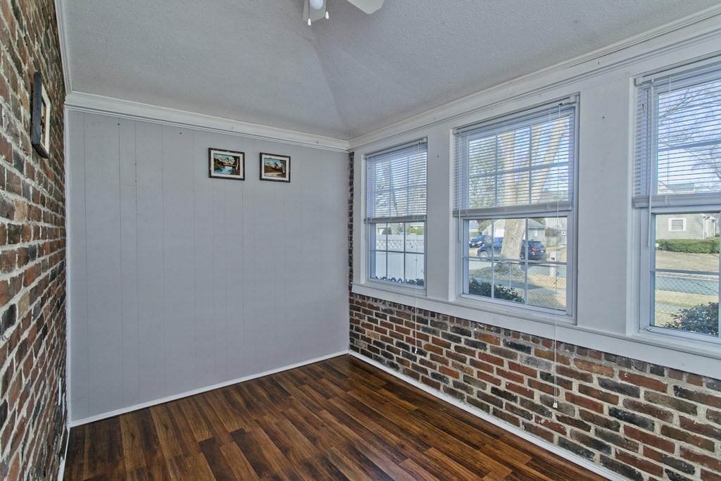2020 Wilbraham Road Springfield, MA 01129 - Photo 14 of 37 a view of an empty room with a window and wooden floor