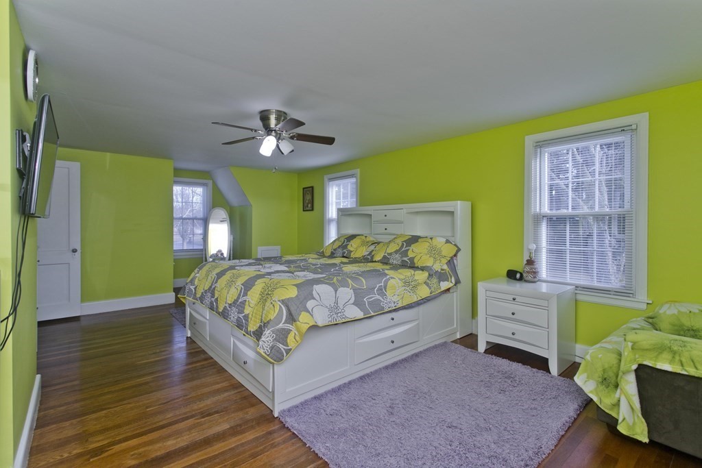 2020 Wilbraham Road Springfield, MA 01129 - Photo 19 of 37 a bedroom with a bed and a chandelier