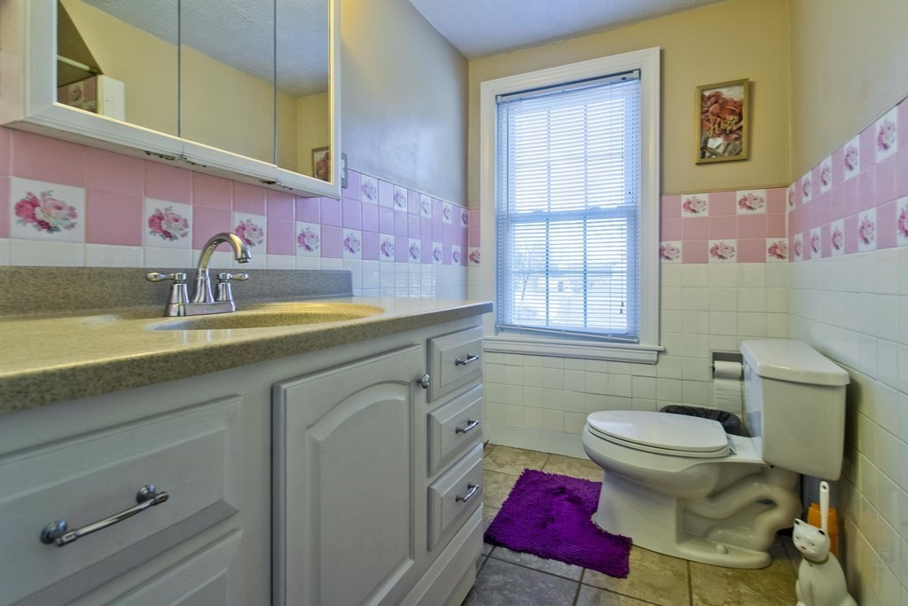 2020 Wilbraham Road Springfield, MA 01129 - Photo 22 of 37 a bathroom with a granite countertop toilet sink and mirror