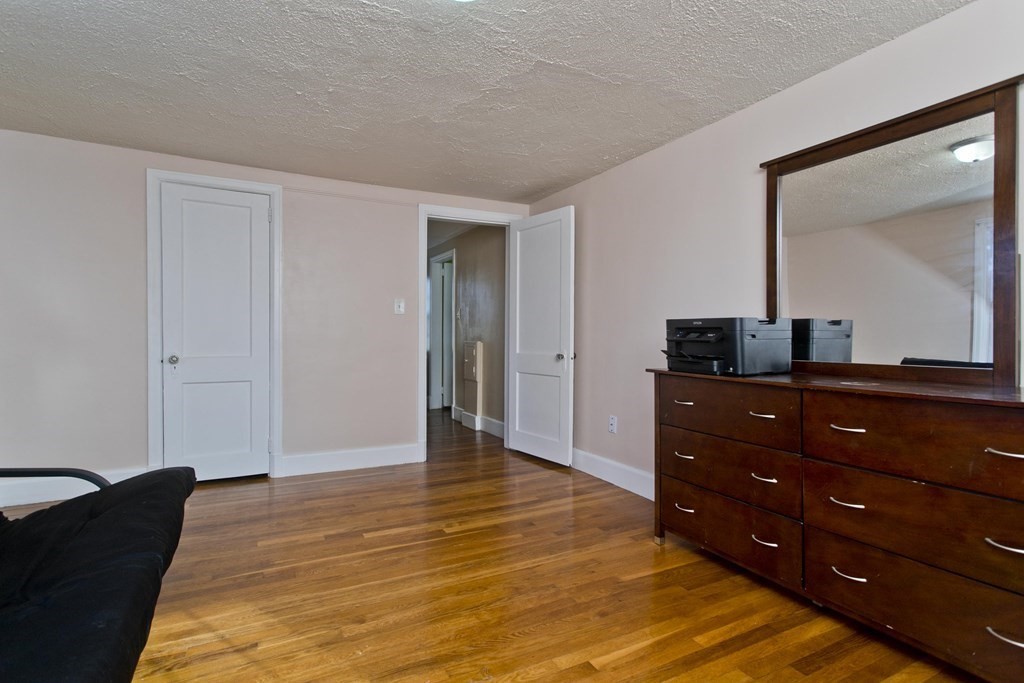2020 Wilbraham Road Springfield, MA 01129 - Photo 23 of 37 a room with a dresser and a mirror