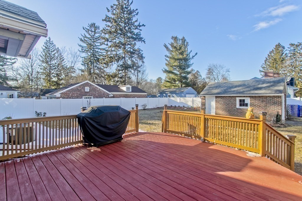 2020 Wilbraham Road Springfield, MA 01129 - Photo 31 of 37 a view of a roof deck with wooden floor and fence with a barbeque grill and couches