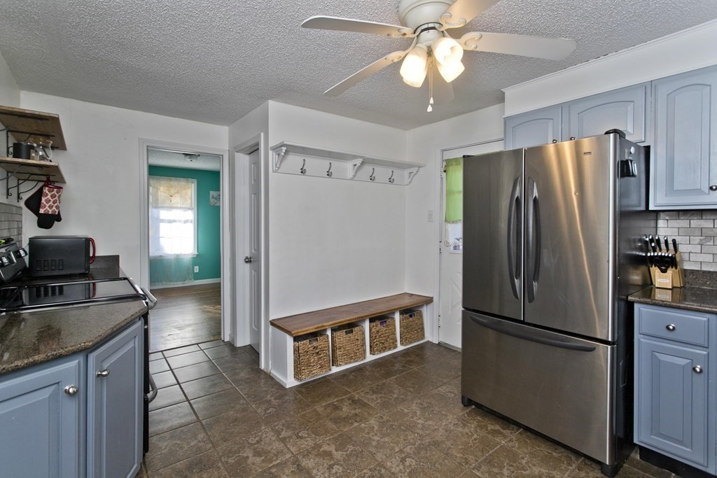 2020 Wilbraham Road Springfield, MA 01129 - Photo 4 of 37 a kitchen with stainless steel appliances granite countertop a refrigerator a sink a stove and island