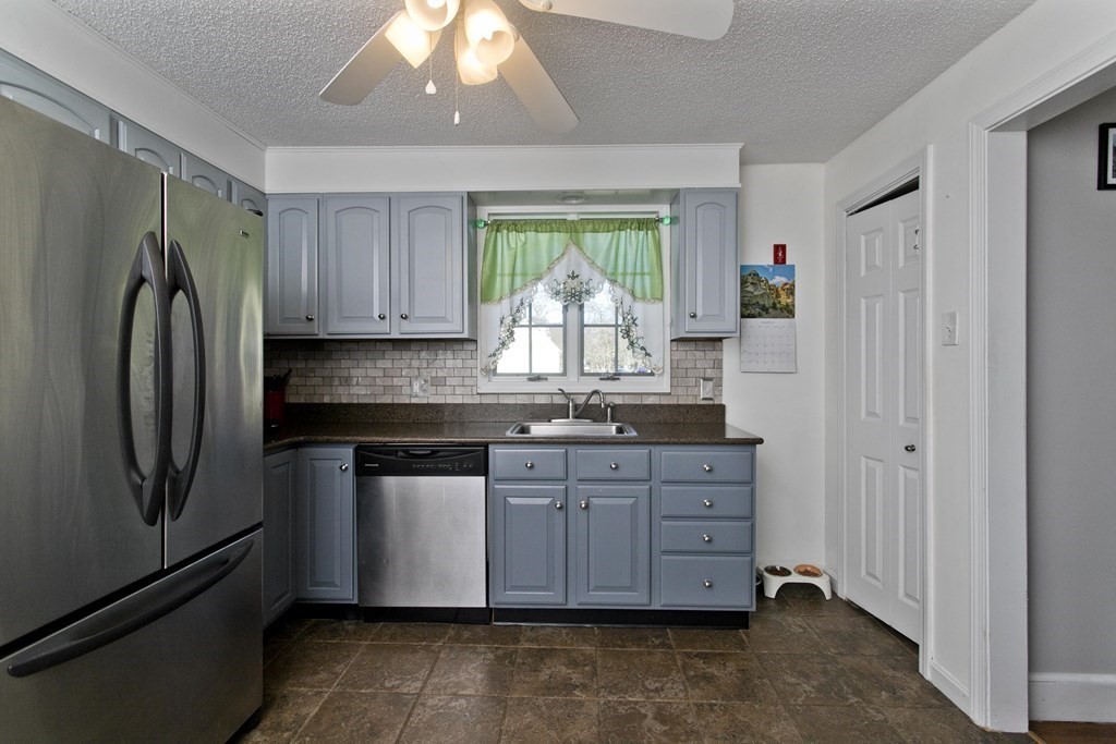 2020 Wilbraham Road Springfield, MA 01129 - Photo 5 of 37 a kitchen with stainless steel appliances granite countertop a refrigerator and a stove