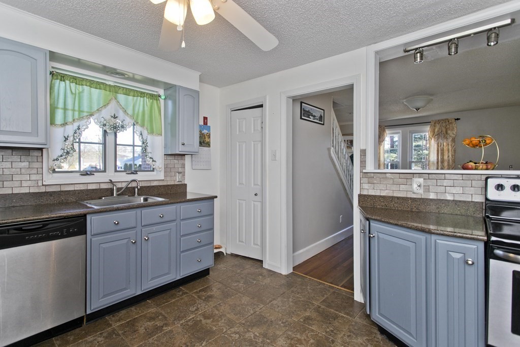 2020 Wilbraham Road Springfield, MA 01129 - Photo 6 of 37 a kitchen with granite countertop a stove and a sink