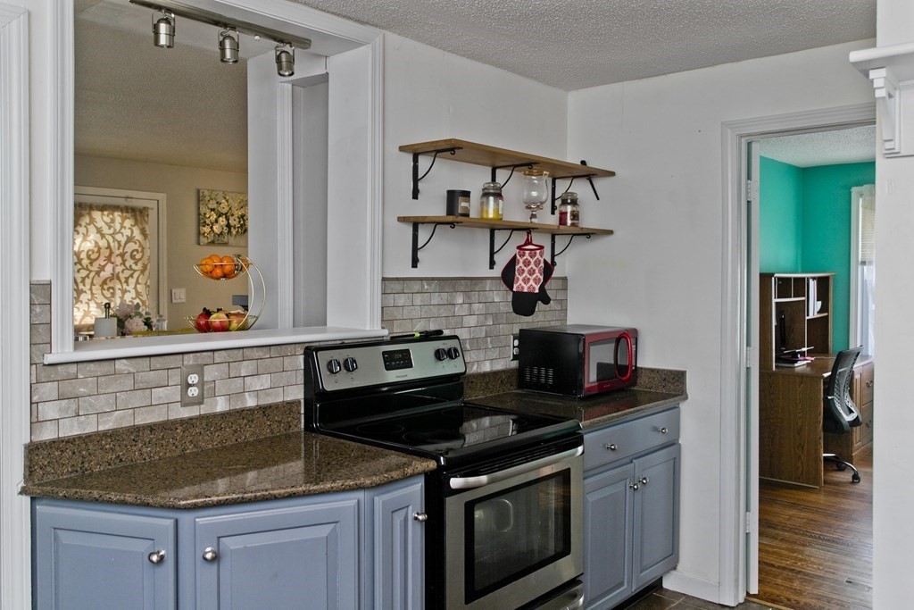 2020 Wilbraham Road Springfield, MA 01129 - Photo 7 of 37 a kitchen with stainless steel appliances granite countertop a sink stove and cabinets