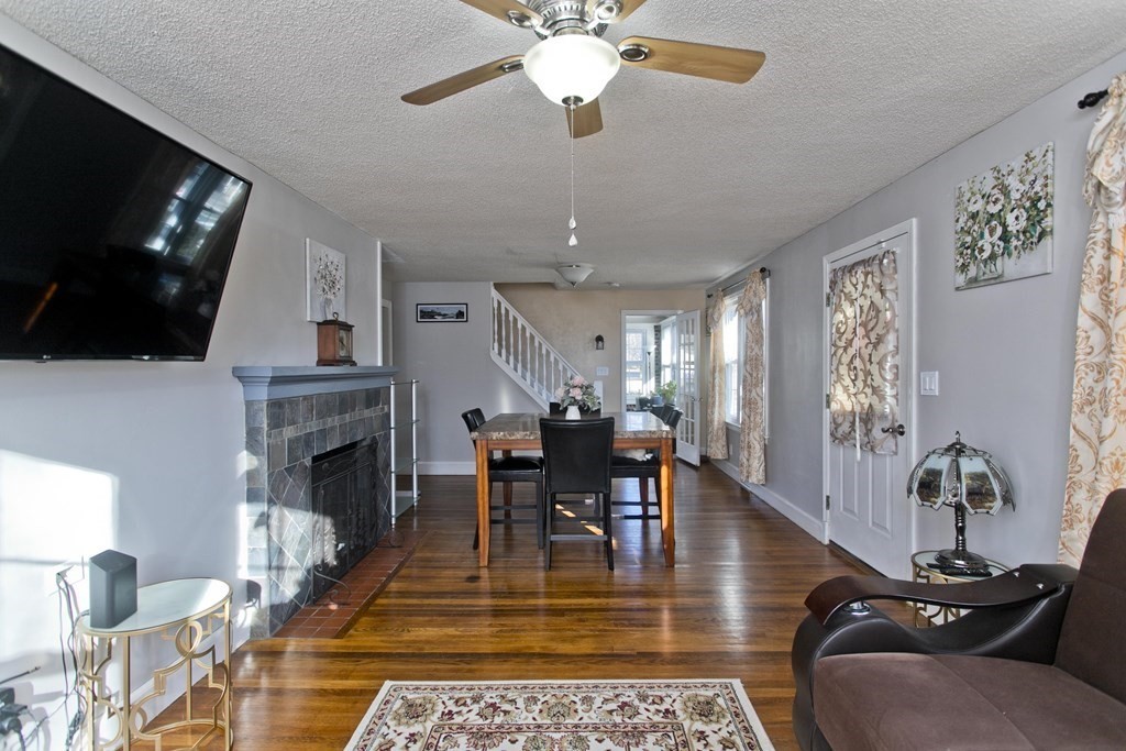 2020 Wilbraham Road Springfield, MA 01129 - Photo 10 of 37 a living room with furniture a fireplace and a flat screen tv