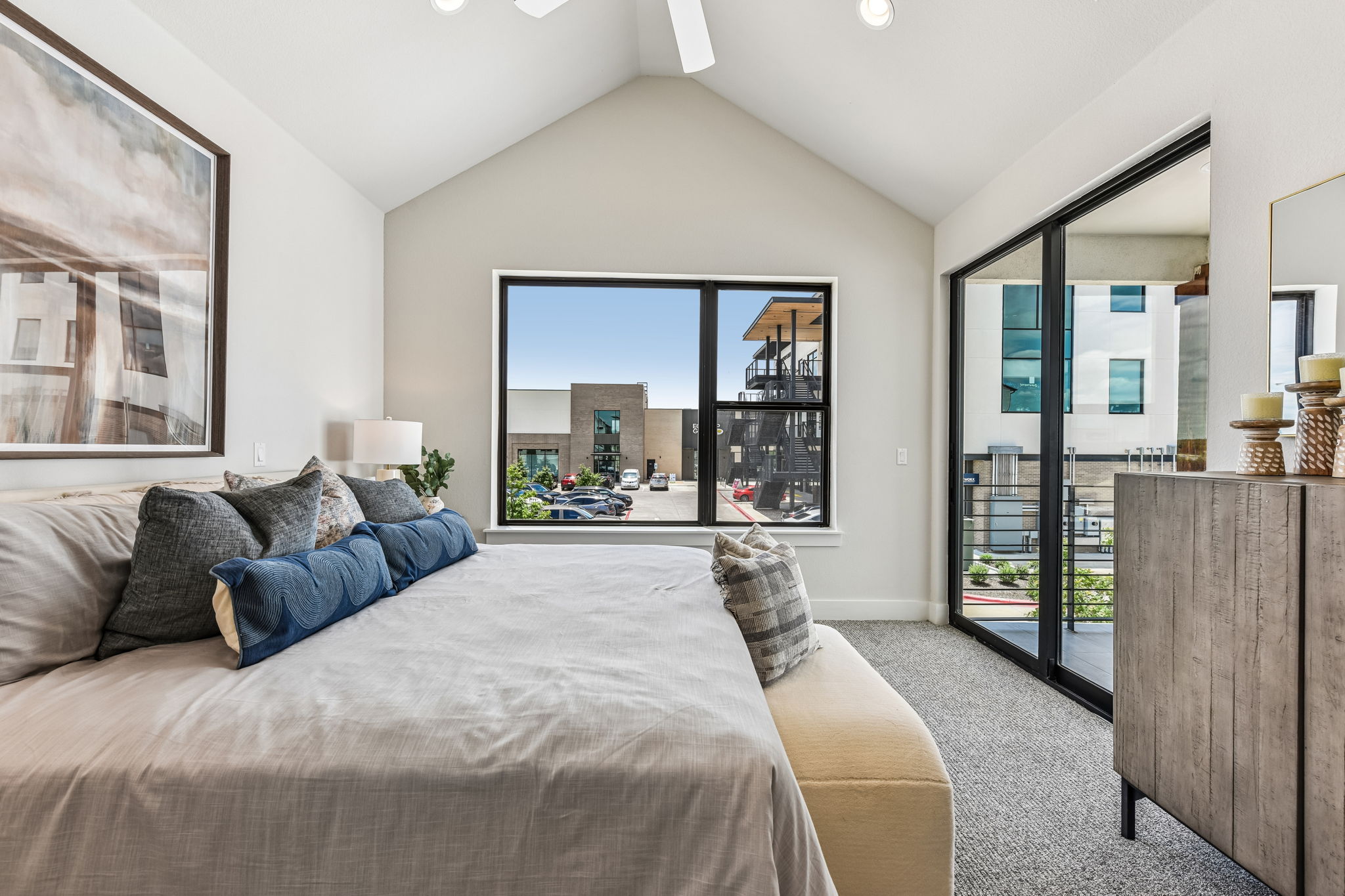 9033 Cattle Baron Path Austin, TX 78747 - Photo 29 of 40 Soaring vaulted ceilings complement ample natural light and a private balcony access in this comfortable primary bedroom.