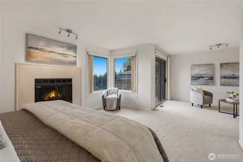a living room with furniture and a painting on the wall