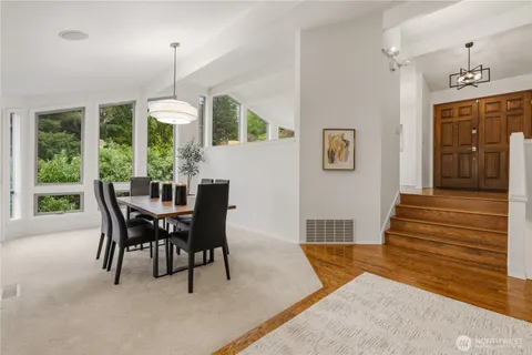 a view of a dining room with furniture window and outside view