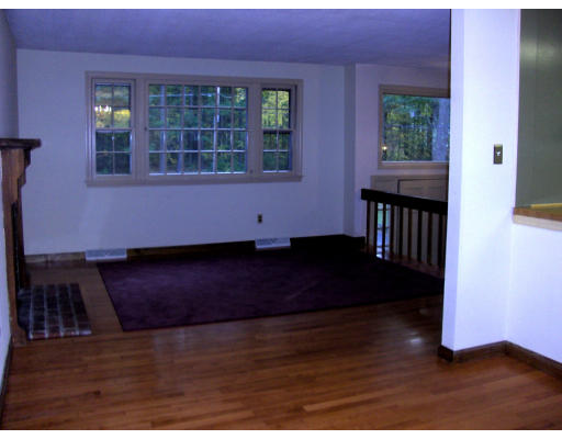 687 Townsend Road Groton, MA 01450 - Photo 11 of 17 a view of an empty room with wooden floor and windows