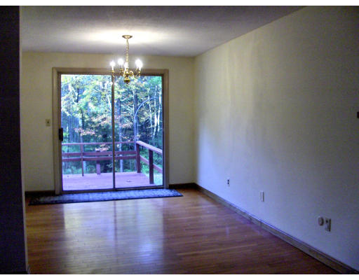 687 Townsend Road Groton, MA 01450 - Photo 5 of 17 a view of a livingroom with wooden floor