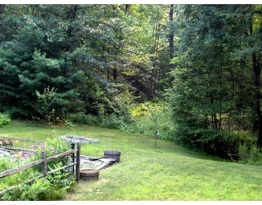 687 Townsend Road Groton, MA 01450 - Photo 9 of 17 a backyard of a house with a yard and lake view