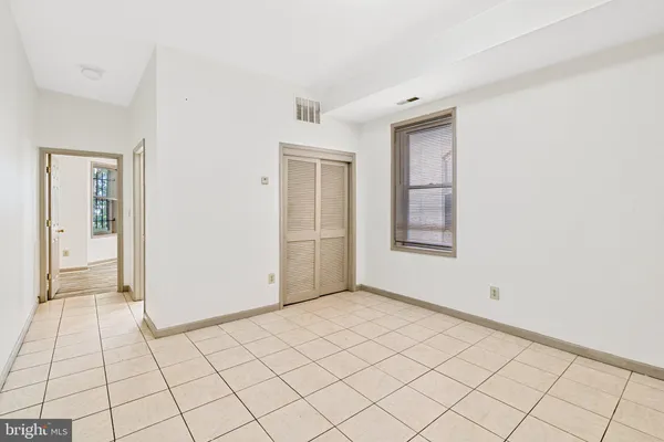 a view of an empty room and window