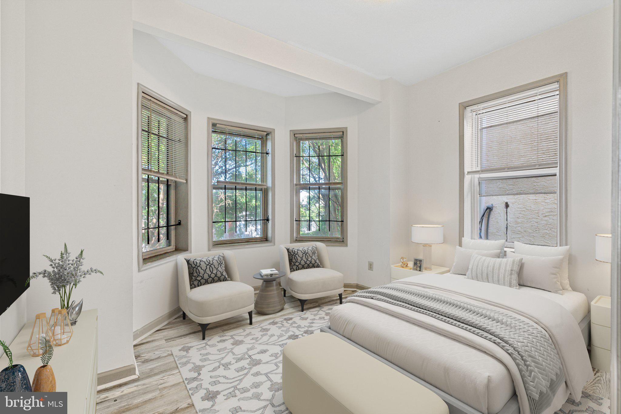 1621 West Diamond Street Philadelphia, PA 19121 - Photo 8 of 18 a bedroom with a bed and wooden floor