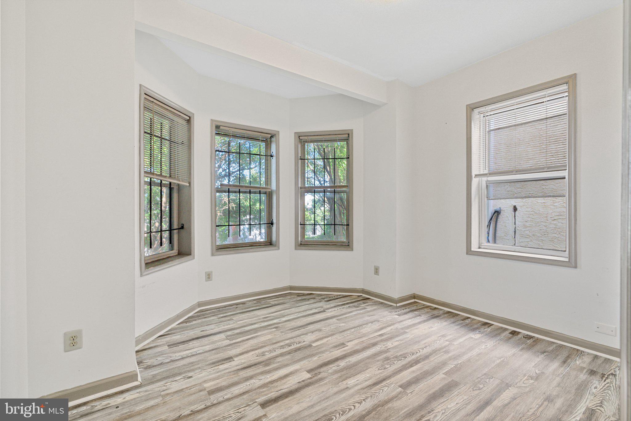 1621 West Diamond Street Philadelphia, PA 19121 - Photo 9 of 18 a view of empty room with wooden floor and fan