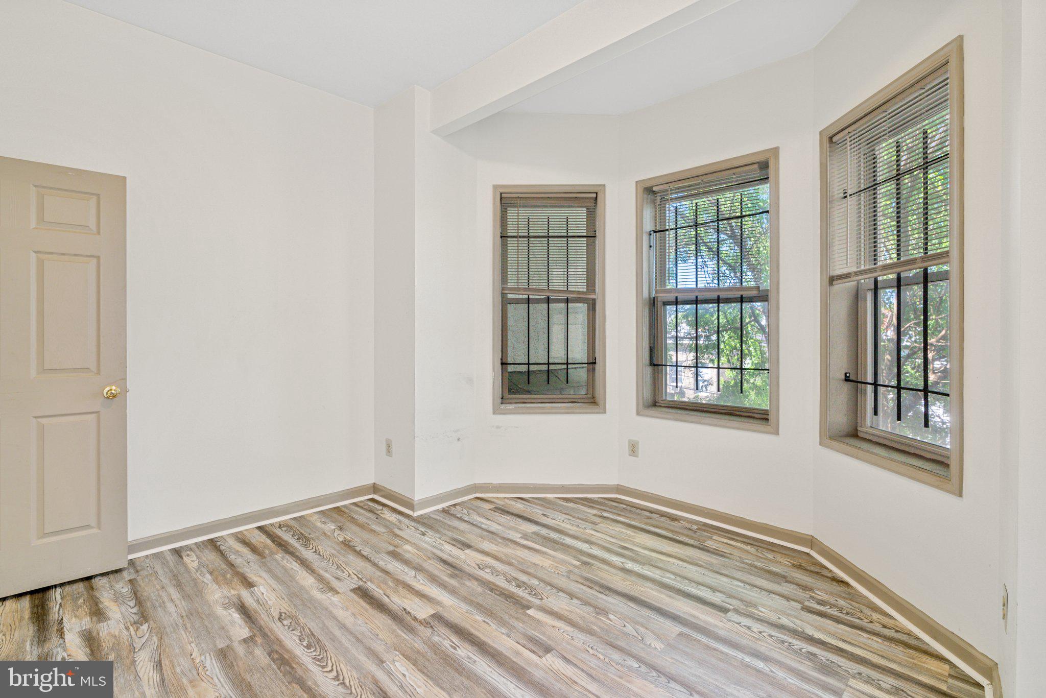 1621 West Diamond Street Philadelphia, PA 19121 - Photo 10 of 18 a view of empty room with wooden floor and fan