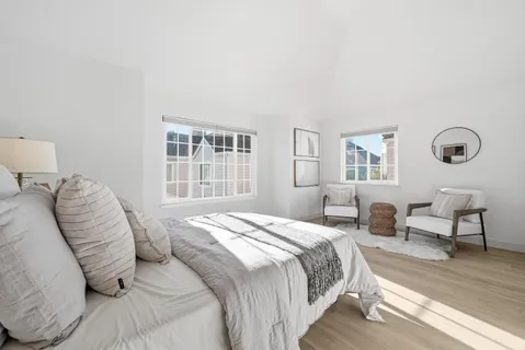 a bedroom with a bed and a table