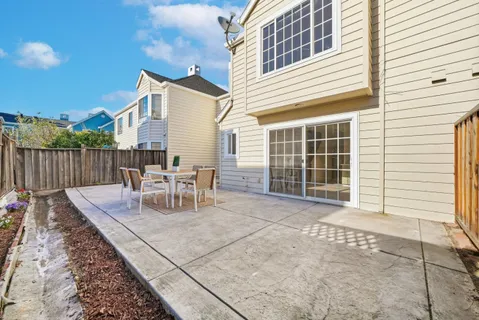 a view of a house with backyard and porch