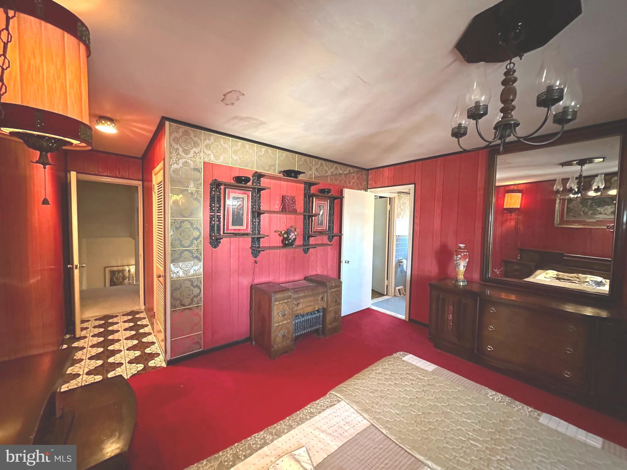 2740 Mower Street Philadelphia, PA 19152 - Photo 12 of 23 a bedroom with a bed and dresser with mirror