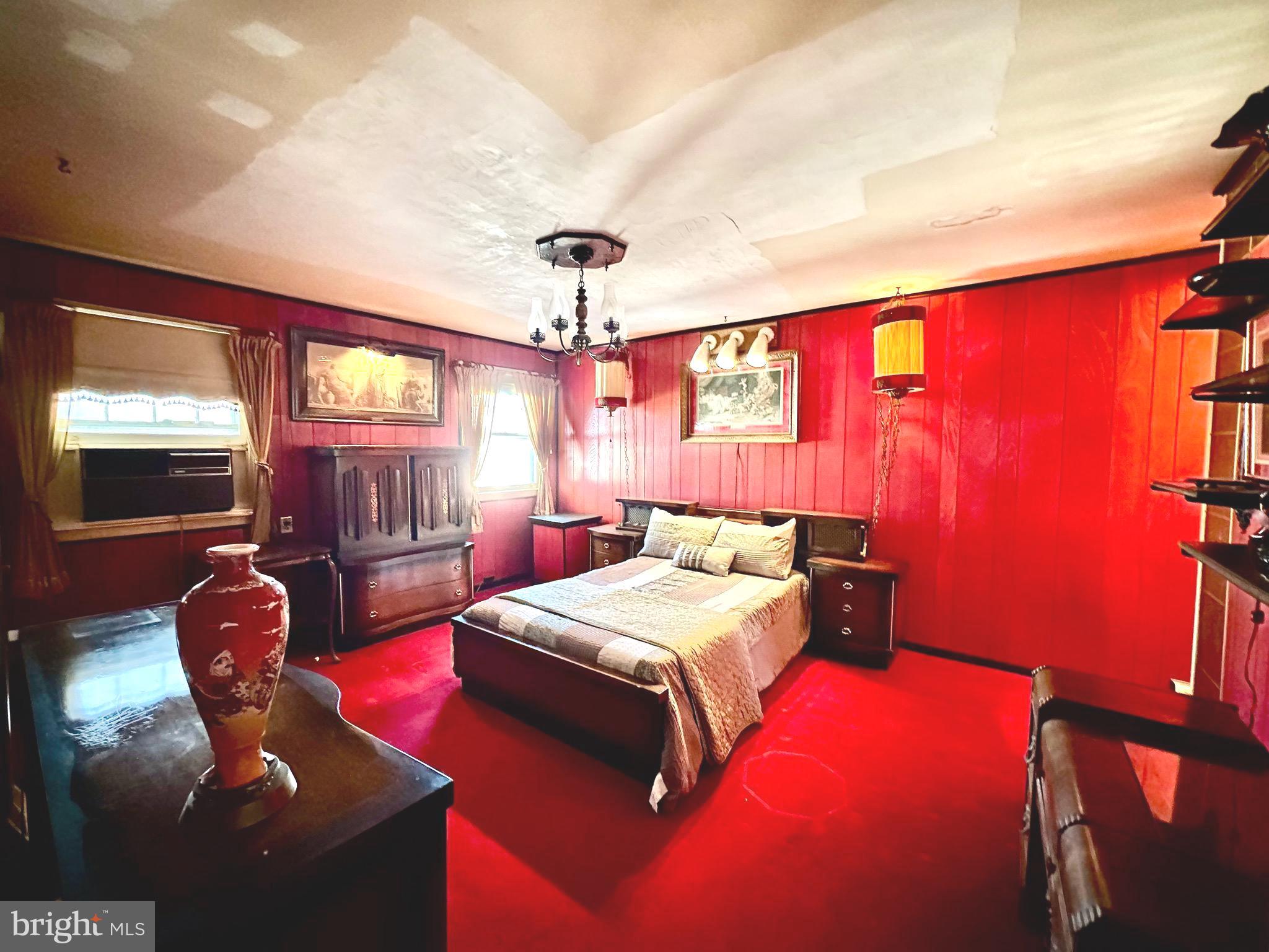 2740 Mower Street Philadelphia, PA 19152 - Photo 16 of 23 a bedroom with furniture and a chandelier